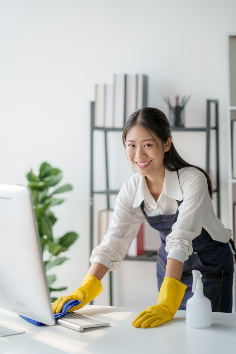 Asian young cleaning service woman worker clean table at home. Beautiful young girl housekeeper clea